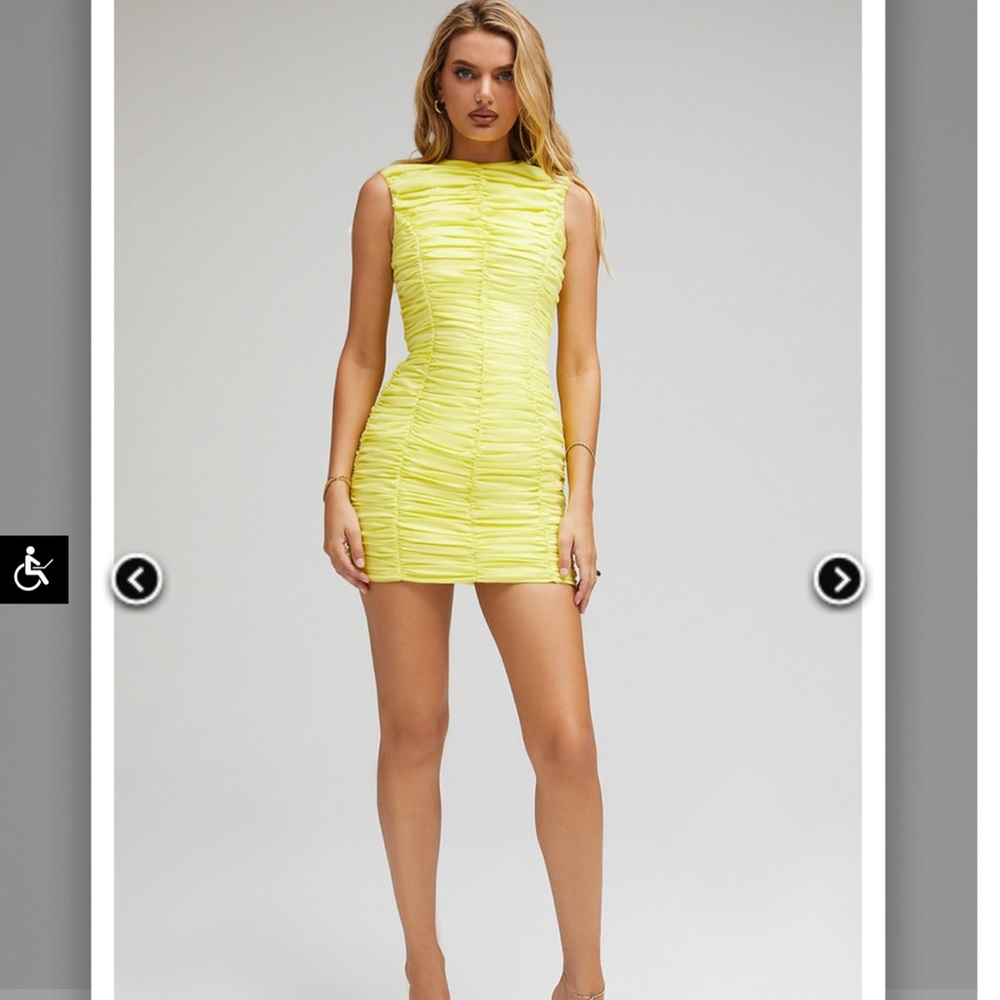 Mistress rocks yellow mini dress.